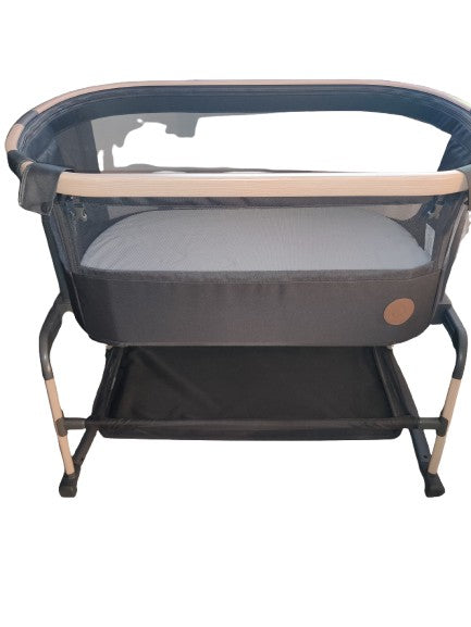 Maxi-cosi Iora Air beside crib.